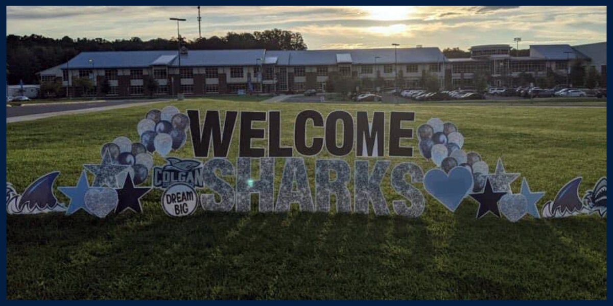 welcome sharks sign at front of school